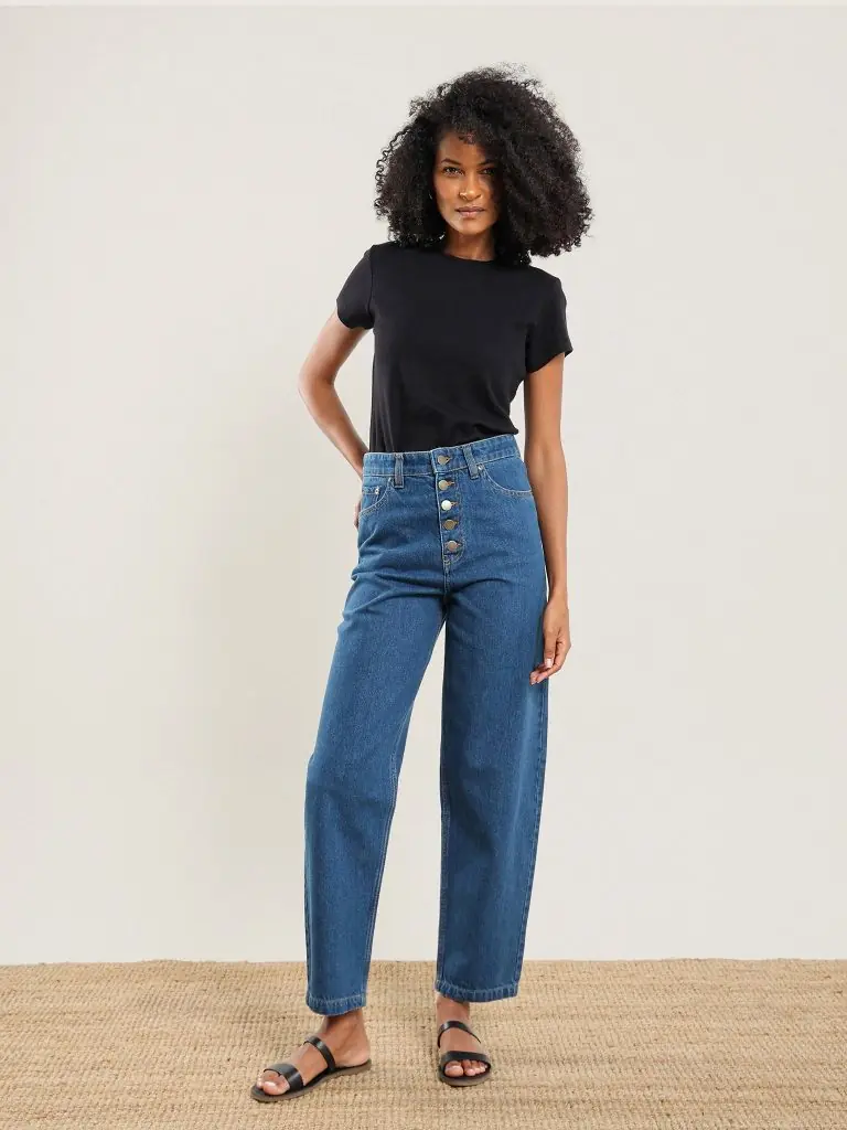 a woman wearing a pair of organic cotton high waisted sustainable jeans from nazeerah