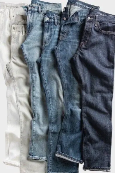 several pairs of sustainable jeans in different denim colors