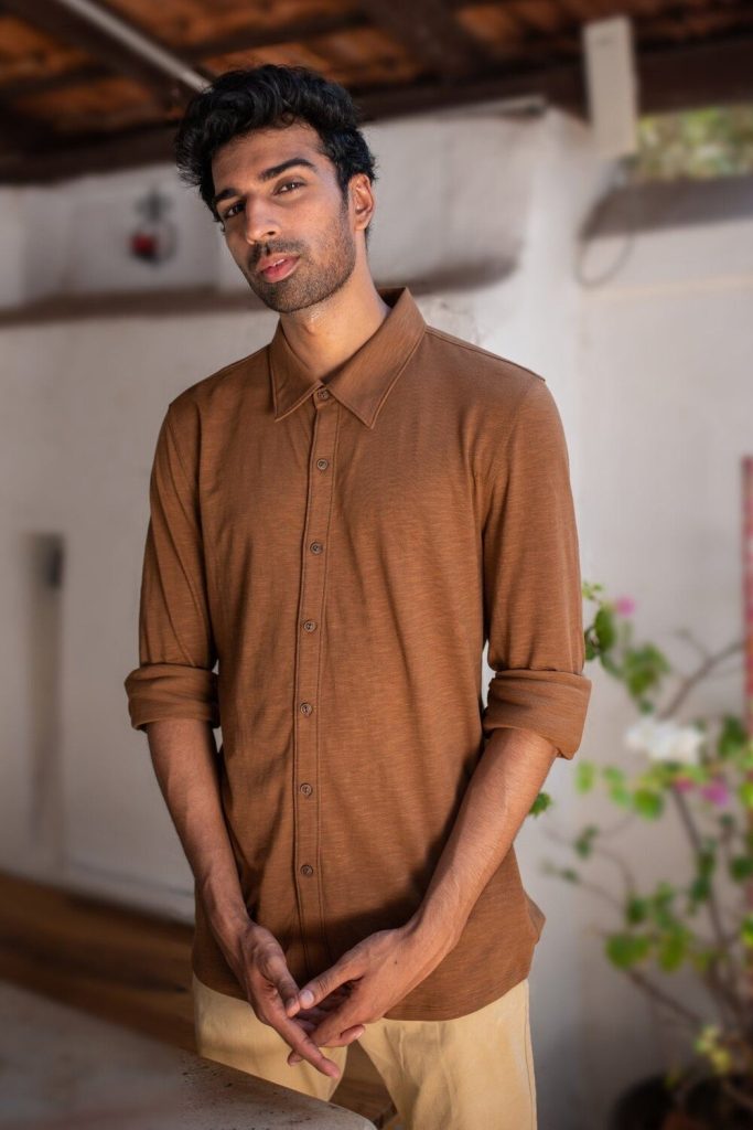 a man wearing a sustainable t-shirt from ethical clothing store Made Trade