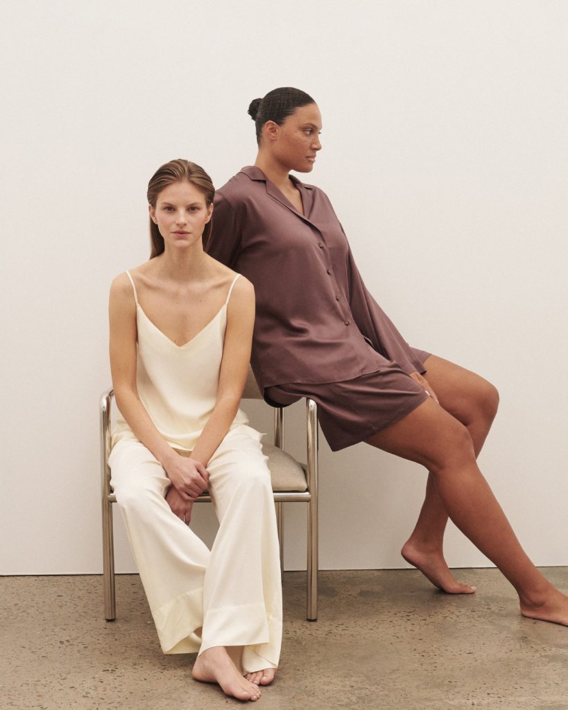 Two women wearing vegan silk pajamas from affordable sustainable clothing brand Boody