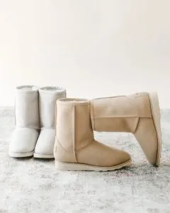 Two pairs of sustainable winter boots that are an eco-friendly alternative to UGGs