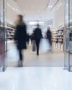 people shopping at a fast fashion store in the mall
