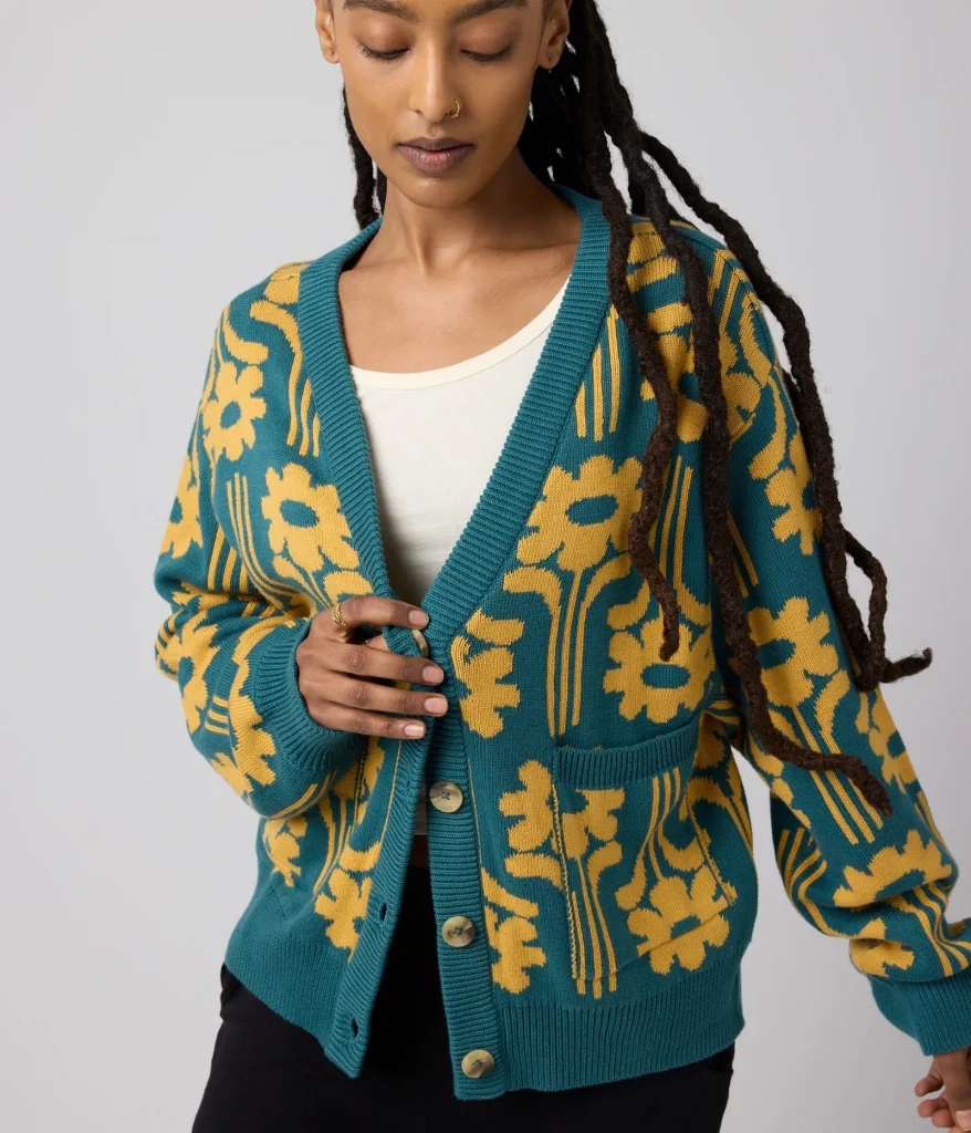 woman wearing an organic sweater with a cute print from affordable sustainable clothing brand Known Supply