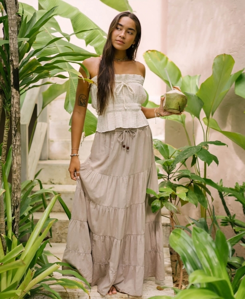 woman wearing a flowy organic cotton top and skirt from affordable sustainable brand soul flower